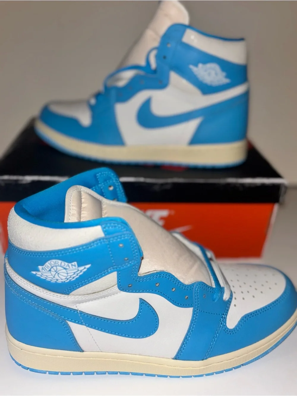 Jordan Air Jordan 1 Mid White and Blue Sneakers